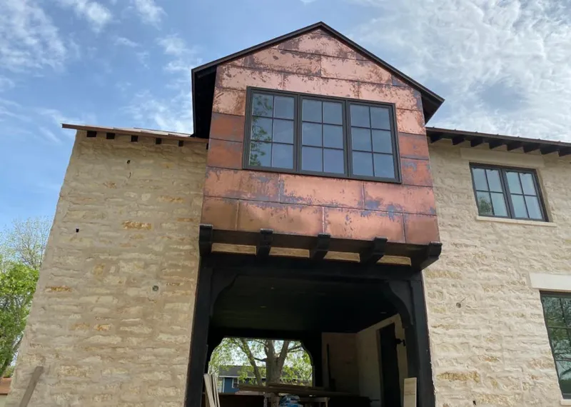 Copper metal panel facade on a stone building for Metal Roof Coating in Middleburg